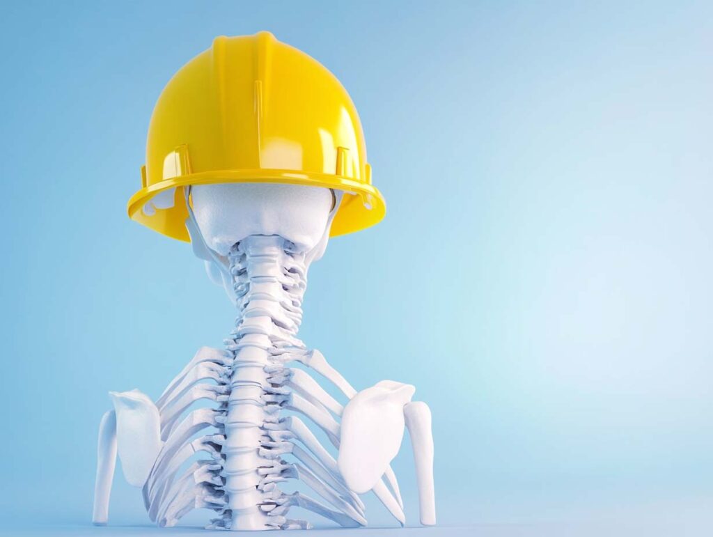 A spine wearing a hardhat